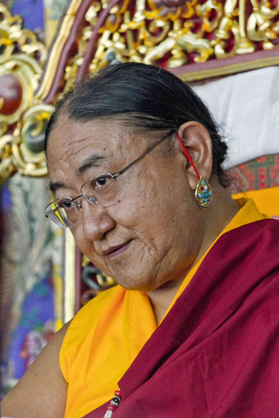 His Holiness in ceremonial crown and brocade robes